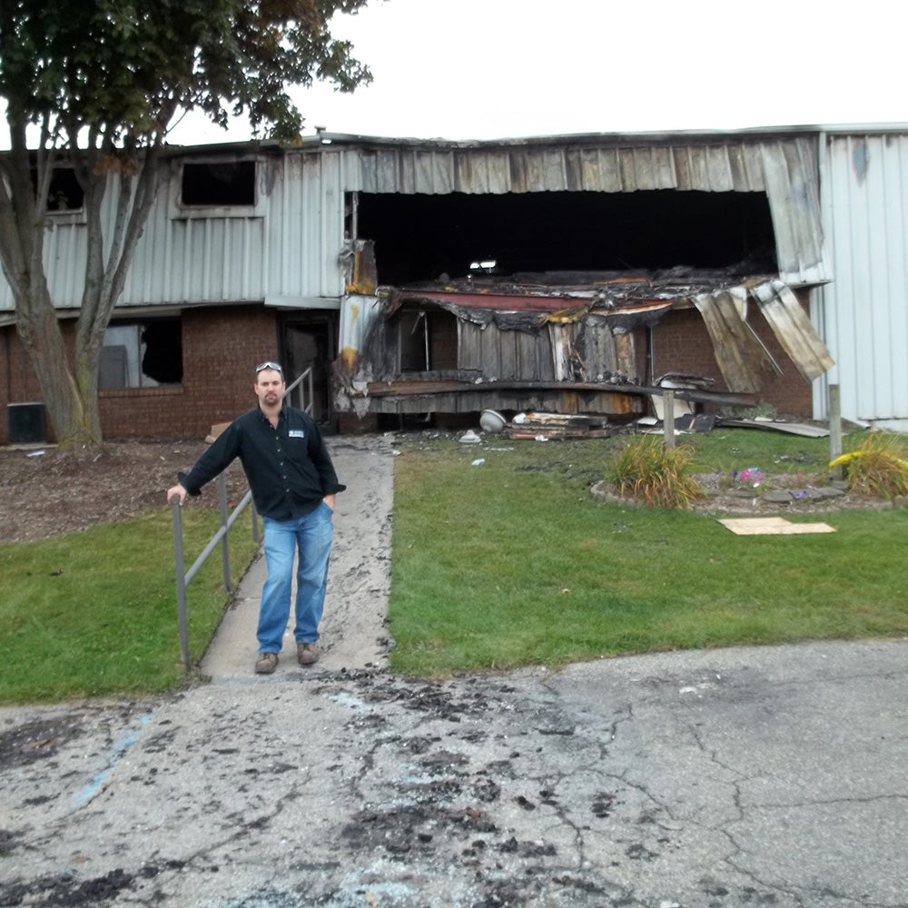 Brian outside CMS after the 2011 building fire
